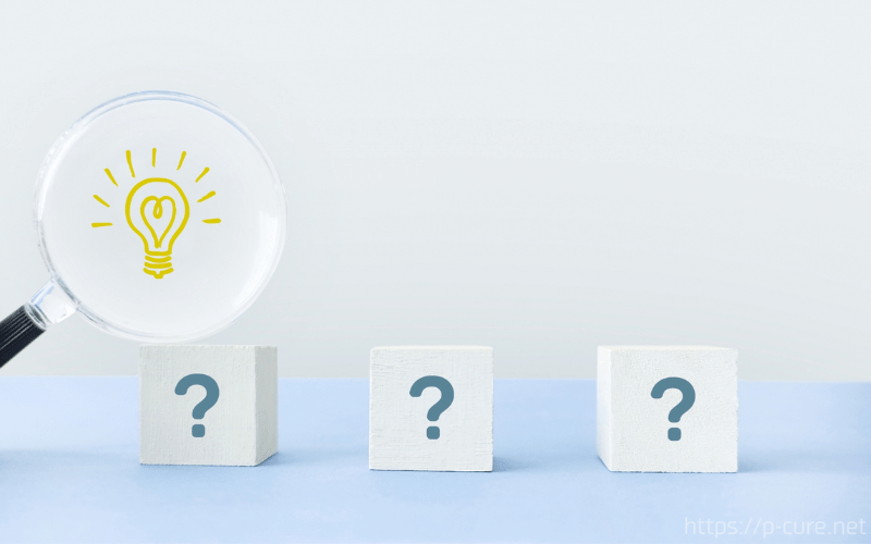 クエスチョンマークとひらめきマークが描かれた虫眼鏡